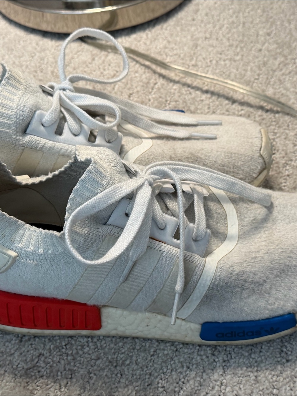 a Adidas NMD R1 PK Vintage White Men's Size 11
